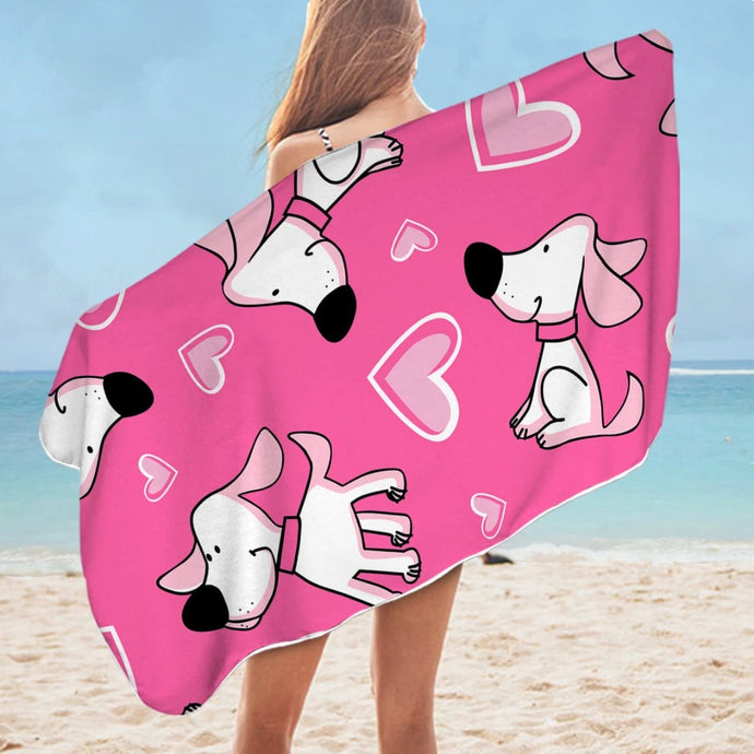 Image of a lady flaunting her labrador beach towel in the color pink